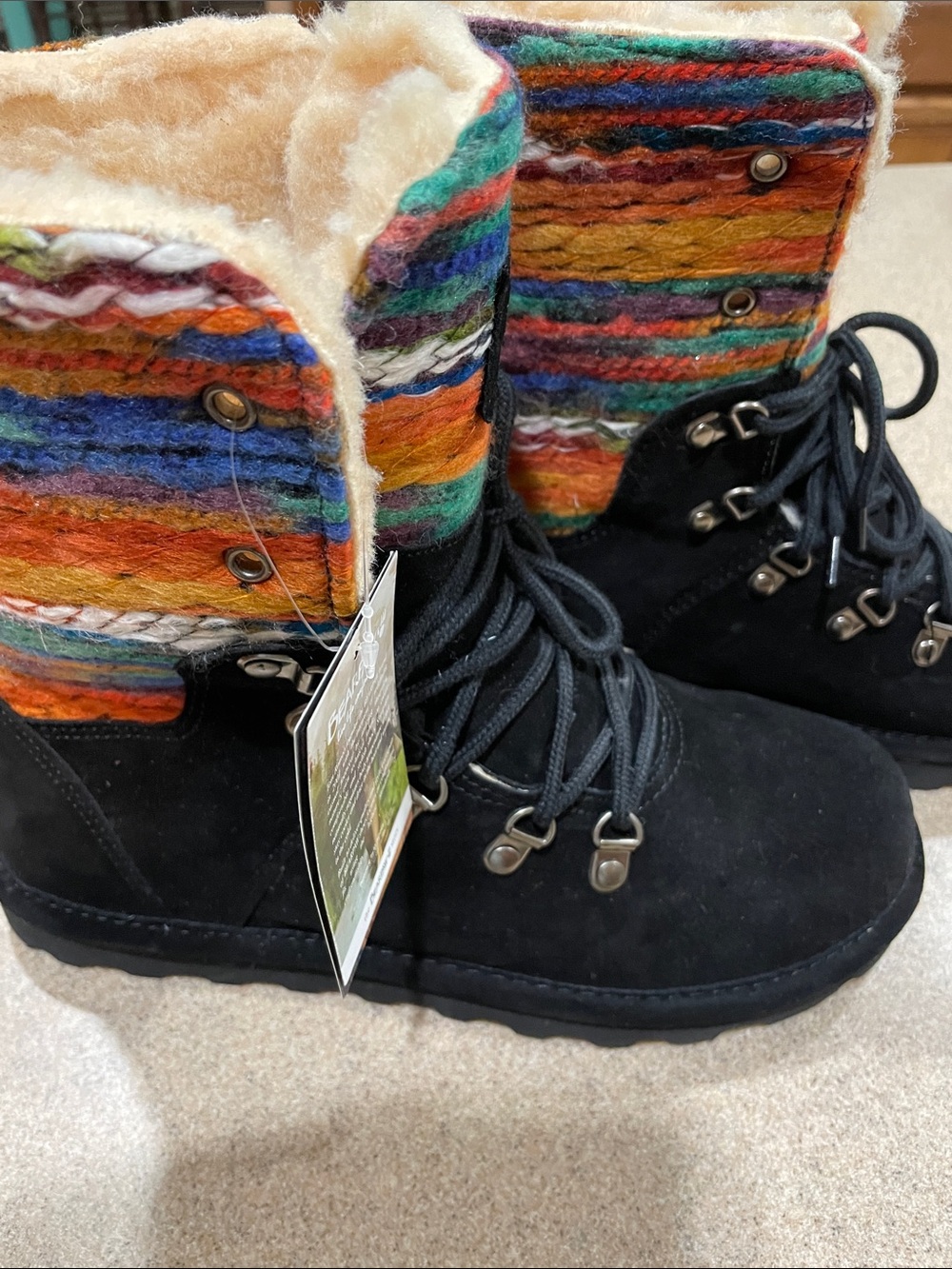 The Bearpaw Maria lace-up boot features black suede lower construction.  New